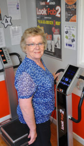 Wendy from Lesley Shand Funeral Service trying out one of the Good Vibration machines that will be at the 50-plus information day