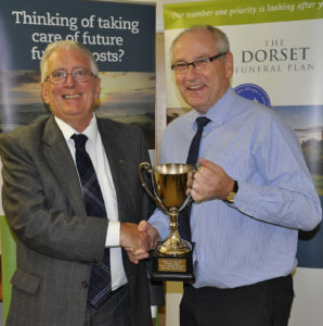 Peter Douch from the sponsors, The Dorset Funeral Plan, with Pete Tucker from Charlton Down - the team of the year.