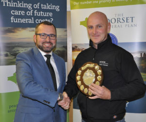 Shane Watson (left) from the sponsors, the Dorset Funeral Plan, with Anthony Mercer from Chalke Valley CC, Div 5 winners