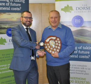 Shane Watson (left) from the sponsors, the Dorset Funeral Plan, with Chris Ralph from Marnhill CC, Division 6 winners.