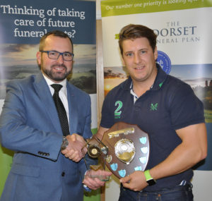 Shane Watson (left) from the sponsors, the Dorset Funeral Plan, with David Coy, of Cranborne CC, Div 3 winners