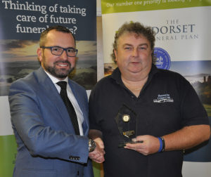 Shane Watson (left) from the sponsors, the Dorset Funeral Plan, with Stuart Peters of Hamworthy Rec II, Div 4 runners-up