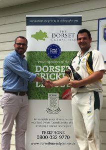 Shane Watson from the sponsor, The Dorset Funeral Plan, presents Bere Regis CC skipper with the team of the Month trophy