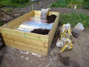 P1000030 03-06-17 filling raised bed with soil