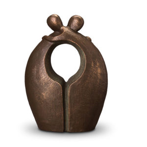 designer handmade ceramic urn showing two people hugging